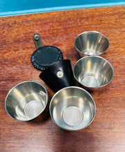 Load image into Gallery viewer, Set o bedwar gwydryn shot stainless steel Ria o Denmarc mewn câs lledr o ganol y ganrif ddiwethaf / Mid Century Danish portable stack of four stainless steel Ria shot glasses in leather walet