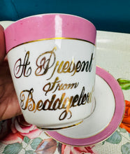 Load image into Gallery viewer, Cwpan a soser binc ‘A present from Beddgelert’ Hynafol / Antique ‘A present from Beddgelert’ pink cup and saucer

