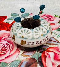 Load image into Gallery viewer, Pin cushion ‘A Present from Penmaenmawr’ ceramig Hynafol / Antique ‘A Present from Penmaenmawr’ ceramic pin cushion
