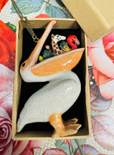 Load image into Gallery viewer, Mwclis ‘And Mary’ Pelican Llwglyd seramig mewn bocs /  ‘And Mary’ Hungry Pelican ceramic necklace in a box
