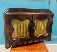 Load image into Gallery viewer, Cwpwrdd cornel bychan Hynafol Fictorianaidd i gadw moddion / cyfrinachau gyda’r gwydr bevelled a’r defnydd melfed gwreiddiol / Antique Victorian small corner cupboard to keep your medicine / secrets with the original bevelled glass and velvet fabric
