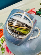 Load image into Gallery viewer, Cwpan a soser las Lustreware ‘Gardens  Promenade and Beach, Barry Island’ Hynafol / Antique ‘Gardens  Promenade and Beach, Barry Island’ blue Lustreware cup and saucer
